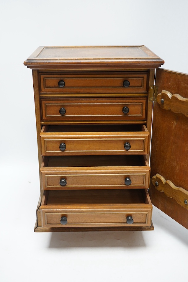 A pair of Victorian Aesthetic period oak table top cabinets, each with five drawers, 38cm high. Condition - fair to good